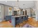 A spacious kitchen featuring a large island with seating, custom cabinetry and stainless appliances at 1614 Brook Rd, Charlotte, NC 28205
