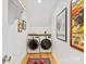Cozy laundry room featuring modern washer and dryer and stylish decor at 1614 Brook Rd, Charlotte, NC 28205