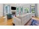 Spacious living room with fireplace, large windows, French doors and hardwood floors at 1614 Brook Rd, Charlotte, NC 28205