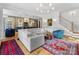 Open-concept living room view showing the kitchen and staircase at 1614 Brook Rd, Charlotte, NC 28205