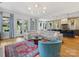 Spacious living room with view of kitchen and outdoor patio and seating area at 1614 Brook Rd, Charlotte, NC 28205