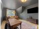 Well-lit office space with hardwood floors, dark walls, a large desk, and modern decor at 1614 Brook Rd, Charlotte, NC 28205