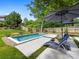 Inviting backyard pool with lounge chairs and shaded area for relaxation at 1614 Brook Rd, Charlotte, NC 28205