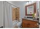 Bathroom with a tile shower and granite countertops at 21305 Sandy Cove Rd, Cornelius, NC 28031