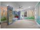 Bright bedroom with custom castle bunk bed, built-in shelves, large windows, and wall art at 21305 Sandy Cove Rd, Cornelius, NC 28031