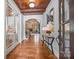 Grand foyer boasts wood floors, wood ceilings, and an open floor plan leading to the living spaces at 21305 Sandy Cove Rd, Cornelius, NC 28031