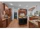 Gourmet kitchen with a center island, granite countertops, and wood cabinetry at 21305 Sandy Cove Rd, Cornelius, NC 28031