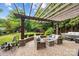 Outdoor patio features comfortable seating, a pergola, a hot tub and a view of the backyard at 21305 Sandy Cove Rd, Cornelius, NC 28031