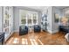 Sitting room features a light blue wall and beautiful hardwood floors at 21305 Sandy Cove Rd, Cornelius, NC 28031