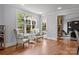 Cozy sitting room with hardwood floors, large windows, and elegant furnishings at 21305 Sandy Cove Rd, Cornelius, NC 28031