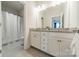 Dual sink bathroom featuring a granite countertop and a shower-tub combination at 2164 Hanging Rock Rd, Fort Mill, SC 29715