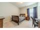 Bedroom with a desk, comfy chair, neutral walls, and soft carpeting at 2164 Hanging Rock Rd, Fort Mill, SC 29715