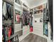 Walk-in closet features custom shelving, multiple hanging rods, and ample storage space at 2164 Hanging Rock Rd, Fort Mill, SC 29715
