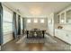 Bright dining room with modern chandelier, table setting, and large windows with natural light at 2164 Hanging Rock Rd, Fort Mill, SC 29715