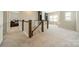 Open hallway with wood and white railing leads to spacious rooms filled with natural light at 2164 Hanging Rock Rd, Fort Mill, SC 29715