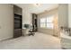 Well-lit office space with built-in shelving, desk, and a large window at 2164 Hanging Rock Rd, Fort Mill, SC 29715