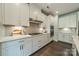 Modern kitchen with white cabinets, stainless steel appliances, and stylish backsplash at 2164 Hanging Rock Rd, Fort Mill, SC 29715