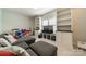 Cozy living room featuring built-in bookshelves and plenty of space for entertaining and relaxation at 2164 Hanging Rock Rd, Fort Mill, SC 29715