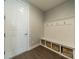 A mudroom includes bench seating with storage in a well-lit area at 2164 Hanging Rock Rd, Fort Mill, SC 29715