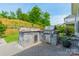Stone outdoor kitchen with a built-in grill and counter space for backyard barbecues at 2164 Hanging Rock Rd, Fort Mill, SC 29715