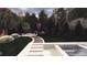 Luxury backyard rendering with custom pool, spa, waterfall, outdoor kitchen, and fire pit at 3030 Brookridge Ln, Charlotte, NC 28211