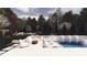 Dream backyard rendering with custom pool, spa, waterfall, outdoor kitchen, and fire pit at 3030 Brookridge Ln, Charlotte, NC 28211