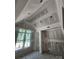 Another spacious bedroom with a vaulted ceiling and large window, ready for drywall and finishes at 3030 Brookridge Ln, Charlotte, NC 28211