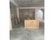 Large kitchen island and surrounding cabinets ready for finishing, showing the scale of the kitchen space at 3030 Brookridge Ln, Charlotte, NC 28211