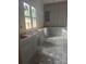 Kitchen with gray shaker cabinets, drawers and large windows, showcasing the potential for a modern space at 3030 Brookridge Ln, Charlotte, NC 28211