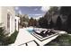 Backyard pool featuring lounge chairs, waterfall feature, and professionally landscaped design and surrounding greenery at 3030 Brookridge Ln, Charlotte, NC 28211
