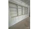 Custom shelving unit with cabinets below provides ample storage space and display options at 3030 Brookridge Ln, Charlotte, NC 28211