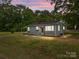 Charming single-story home with tidy landscaping, flower boxes and a covered porch at 322 Corriher Heights Ave, China Grove, NC 28023