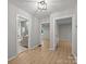 Hallway connecting rooms, showcasing bathroom with stylish finishes and modern neutral paint at 322 Corriher Heights Ave, China Grove, NC 28023