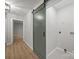 Hallway with modern barn door leading to laundry area and access to other rooms at 322 Corriher Heights Ave, China Grove, NC 28023