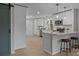 Modern kitchen with white cabinets, quartz countertops, and stainless steel appliances at 322 Corriher Heights Ave, China Grove, NC 28023