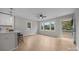 Open-concept living room boasts natural light, modern ceiling fan, and seamless flow to the adjacent kitchen at 322 Corriher Heights Ave, China Grove, NC 28023