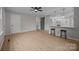 Spacious living space featuring a modern kitchen with breakfast bar, a cozy living room, and open floorplan at 322 Corriher Heights Ave, China Grove, NC 28023