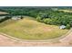 Expansive acreage featuring green pastures, wooded areas, and outbuildings, perfect for a farm or estate at 3400 Baucom Manor Rd, Monroe, NC 28110