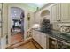 Charming bar area featuring custom cabinetry, wine storage, and stylish countertop at 3400 Baucom Manor Rd, Monroe, NC 28110