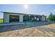 Large barn featuring multiple bays, ample storage, and open workspace with gravel driveway at 3400 Baucom Manor Rd, Monroe, NC 28110