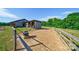 Spacious barnyard with wooden fencing, ample room for livestock, and a well-kept exterior at 3400 Baucom Manor Rd, Monroe, NC 28110