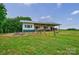Well-maintained barn with green and white trim, featuring ample space for horses and livestock at 3400 Baucom Manor Rd, Monroe, NC 28110