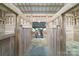 Well-maintained barn stall with two horses, hay, and sturdy wooden structure at 3400 Baucom Manor Rd, Monroe, NC 28110