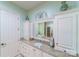 Bathroom with granite countertop, white cabinetry, tub reflected in the mirror and decorative vases at 3400 Baucom Manor Rd, Monroe, NC 28110