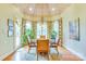 Cozy dining area featuring a unique ceiling and large windows with patterned curtains at 3400 Baucom Manor Rd, Monroe, NC 28110