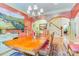 Formal dining room with a large wooden table, elegant chandelier, and access to staircase at 3400 Baucom Manor Rd, Monroe, NC 28110
