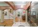 Grand foyer features hardwood floors, arched doorways, and elegant decor, creating a welcoming entrance at 3400 Baucom Manor Rd, Monroe, NC 28110