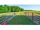 Scenic view of fenced pasture land perfect for horses and livestock with mature trees and green grass at 3400 Baucom Manor Rd, Monroe, NC 28110