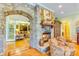 Cozy living room featuring a stone fireplace, hardwood floors, and comfortable seating area at 3400 Baucom Manor Rd, Monroe, NC 28110