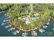 Beautiful aerial view of lake community featuring a clubhouse, tennis courts, and boat slips at 4563 Osprey Run Ct, Denver, NC 28037